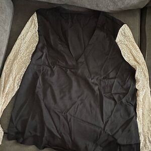 Elegant Black Blouse with Gold Sleeves